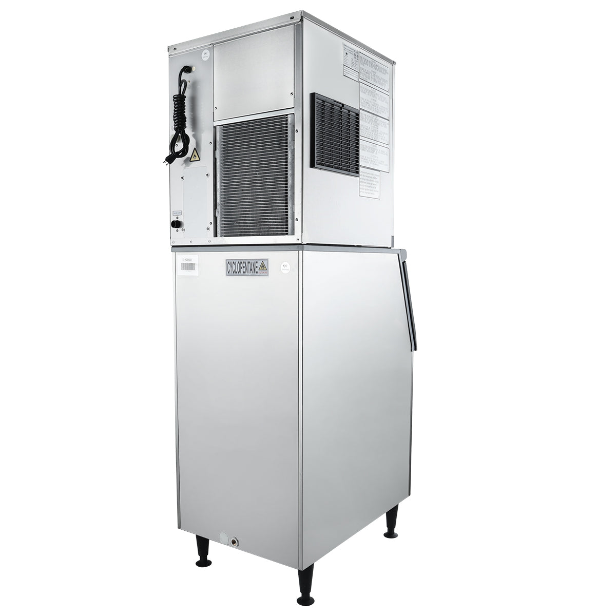 A commercial ice maker with a stainless steel exterior stands on four black legs. The upper section has vents, a coiled black cord, and instruction labels, while the lower part features a ColdSpace label and a handle for the stainless steel ice bin.