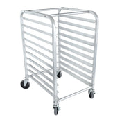 A tall, silver aluminum pan rack with ten horizontal slots for trays, four black caster wheels—two with locks—and rounded top corners, designed for holding or transporting bakery sheets or pans in commercial kitchens. The bun pan rack is empty.