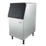 A sleek stainless steel commercial ice storage bin with a black, sloped lid and four sturdy legs. The Empura logo is displayed on the front, pairing perfectly with Empura ice machines for any modern food service environment. Photographed on a white background.