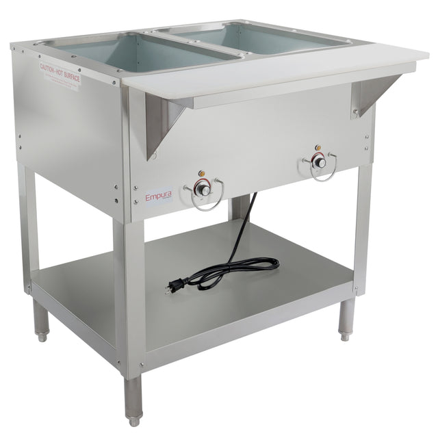 A commercial stainless steel 2-well steam table with deep rectangular wells, front control knobs, a black power cord, and a lower storage shelf. “Empura” is labeled on the front. The unit stands on four legs and has a clean, modern design.