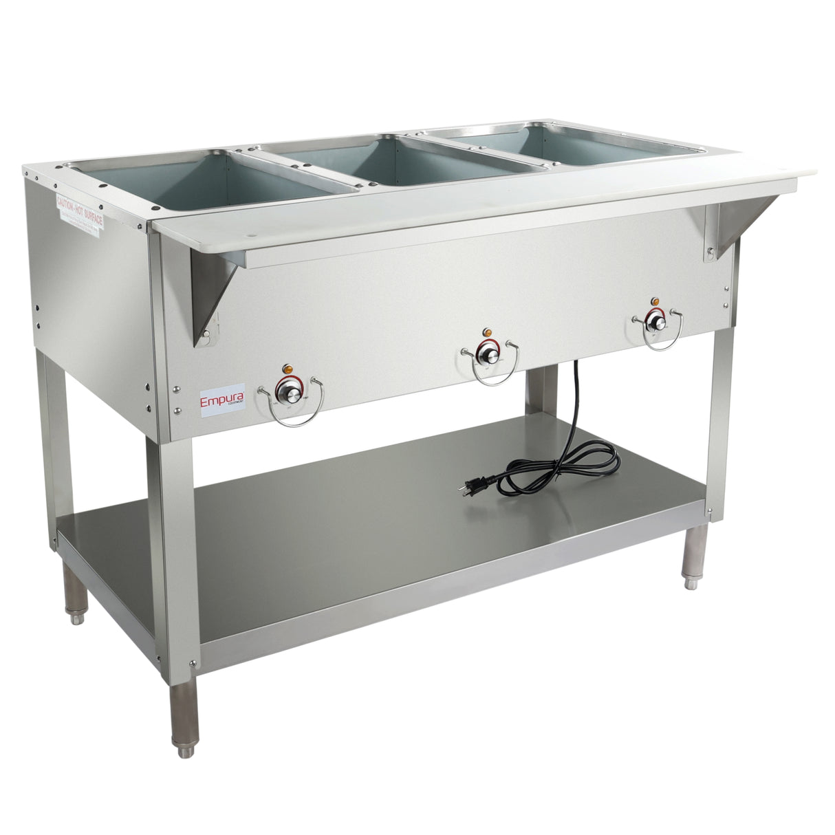 A commercial stainless steel 3-well steam table features control knobs on the front, an open lower shelf, four sturdy legs, and a power cord resting on the shelf. The top includes three rectangular wells for holding food pans.