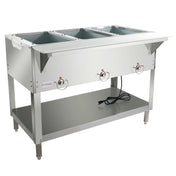 A commercial stainless steel 3-well steam table features control knobs on the front, an open lower shelf, four sturdy legs, and a power cord resting on the shelf. The top includes three rectangular wells for holding food pans.