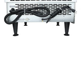 The image shows the back of a commercial ice machine with black ventilation slots, four black legs, two coiled black power cords, and a label reading “Ice water outlet.” The power plug is visible on the right side of the appliance.