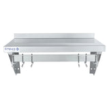 A stainless steel wall-mounted shelf with a backsplash, labeled “Empura,” features six metal pot rack hooks beneath the shelf; two metal wall brackets support the unit. The design is clean and minimal with a commercial kitchen style.