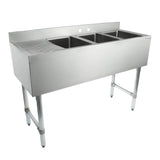 A commercial 3 compartment stainless steel underbar sink featuring three deep rectangular basins and a ribbed drainboard on the left, supported by four sturdy cylindrical legs. The high backsplash includes two faucet holes.