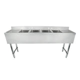 A commercial-grade 4 compartment stainless steel sink with deep rectangular basins and tall legs, designed for heavy-duty kitchen use. Features a raised backsplash with faucet holes and a flat counter area around the basins.