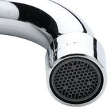 Close-up of a shiny, curved stainless deck mount faucet spout with a circular aerator. The aerator features a honeycomb-like mesh pattern, and reflections appear on the metal surface. The background is plain and white.