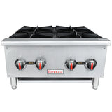 A stainless steel commercial gas hot plate with four black cast iron top grates, four control knobs with red accents, and the “Empura” brand on the front. Designed for countertop installation, this unit features sturdy legs and an industrial look.