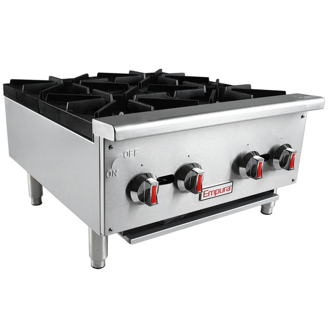A stainless steel commercial gas hot plate range with cast iron top grates, four black burners, three control knobs with red accents, “Empura” branding, sturdy metal legs, and a labeled control panel designed for countertop installation.