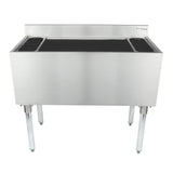 A commercial NSF ice bin with a backsplash and four sturdy legs. This rectangular stainless steel underbar ice bin features two round bottle holders on each side and a deep open top for storing ice, perfect for any bar or restaurant setting.