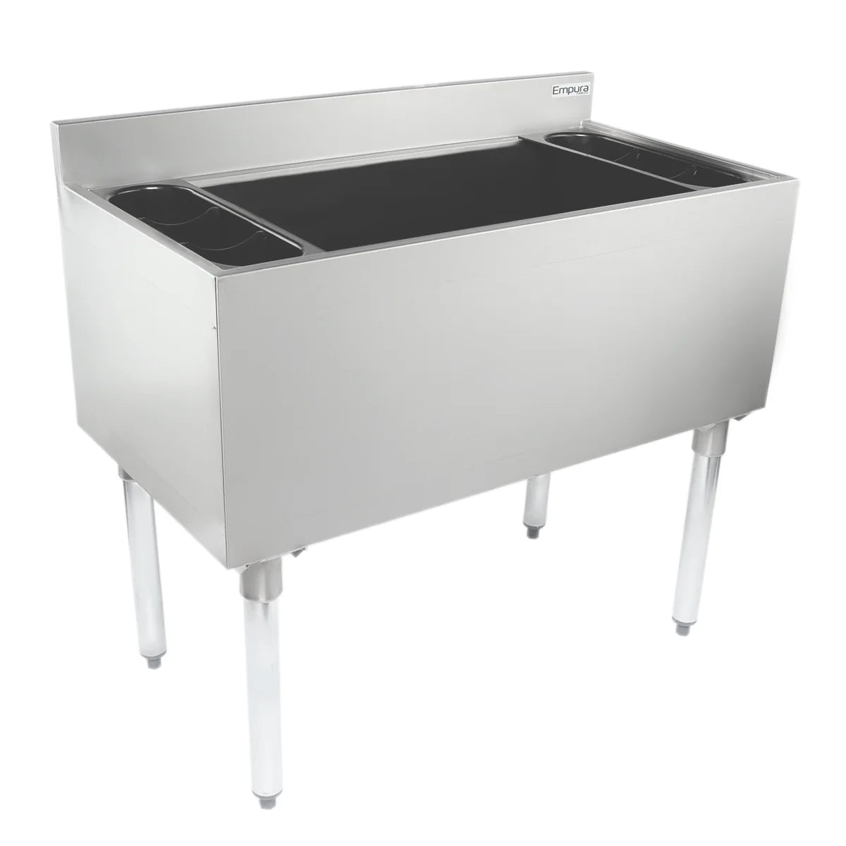 A stainless steel commercial sink with four legs, high backsplash, and deep rectangular basin. Two side drainboards are at each end. The polished surface and minimalistic design pair well with an underbar ice bin for kitchen or industrial use.