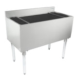 A stainless steel commercial sink with four legs, high backsplash, and deep rectangular basin. Two side drainboards are at each end. The polished surface and minimalistic design pair well with an underbar ice bin for kitchen or industrial use.