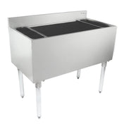 A stainless steel commercial sink with four legs, high backsplash, and deep rectangular basin. Two side drainboards are at each end. The polished surface and minimalistic design pair well with an underbar ice bin for kitchen or industrial use.