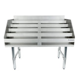 A stainless steel Underbar Liquor Display Stand with four horizontal slots for draining or organizing items, supported by four sturdy legs. NSF certified, with the Empura logo on the right front panel and slightly raised back and side edges.