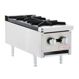 A close-up of a countertop gas hot plate highlights the sturdy design and efficiency perfect for any kitchen setup.