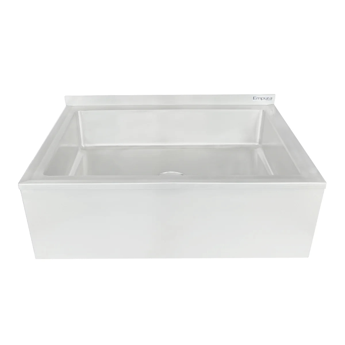 A white farmhouse-style kitchen sink with a rectangular, deep basin and a slightly raised back edge; reminiscent of an NSF mop sink, it’s viewed from the front with a centered drain hole and a subtle brand label in the back right corner.