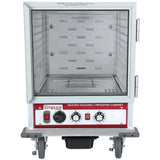 A stainless steel Heated Holding Cabinet with a 12 pan capacity, on wheels, featuring a clear glass door, vented interior shelves, and control knobs on the front labeled “Empura.” Includes a warning label on top and a black drip tray underneath.