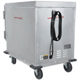 A large, rectangular, silver metal proofers and heated cabinet cart with four gray caster wheels and a hinged door. The half size cart features reinforced corners, a 12 pan capacity, and a warning label near the coiled black power cord on the front.
