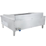 A stainless steel heavy duty charbroiler with four sturdy legs, a gas inlet valve, and a grated cooking surface. This commercial countertop charbroiler features smooth metallic sides, visible screws, and a sloped back splash guard.