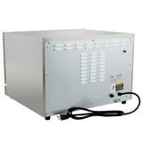 A silver, box-shaped countertop electric oven is viewed from the back, showing a vented metal panel, black power cord with plug, two black knobs, warning label, and small feet. The stainless steel exterior is smooth with ventilation slots and metal screws.