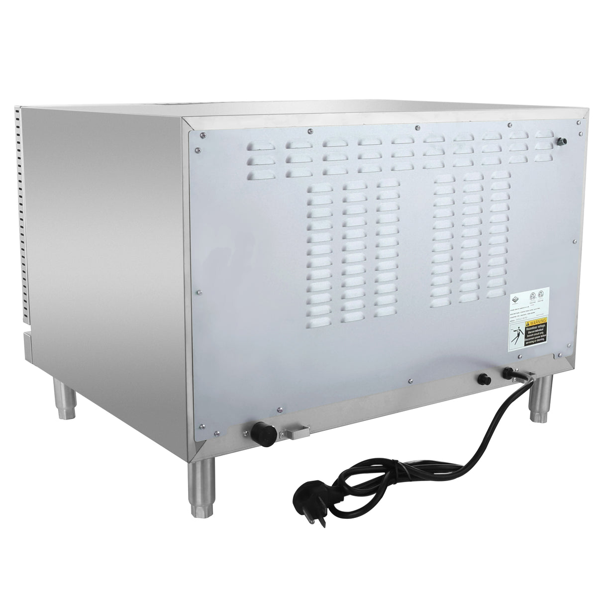 A silver, box-shaped electric countertop oven sits on four metal legs. The image shows the back panel with ventilation slots, a power cord ending in a plug, control knobs, and a manufacturer’s label. The appliance has a stainless steel finish.