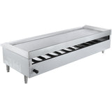 A large commercial stainless steel countertop griddle with raised edges and four short legs. It features a control knob on the front, visible burner elements underneath, and a simple, industrial design—ideal for commercial kitchens.