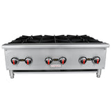A stainless steel commercial gas hot plate with six cast iron top grates, six control knobs with red and black markings, and short cylindrical legs. The front panel displays the Empura brand. Ideal for countertop installation, stove is viewed from the front.