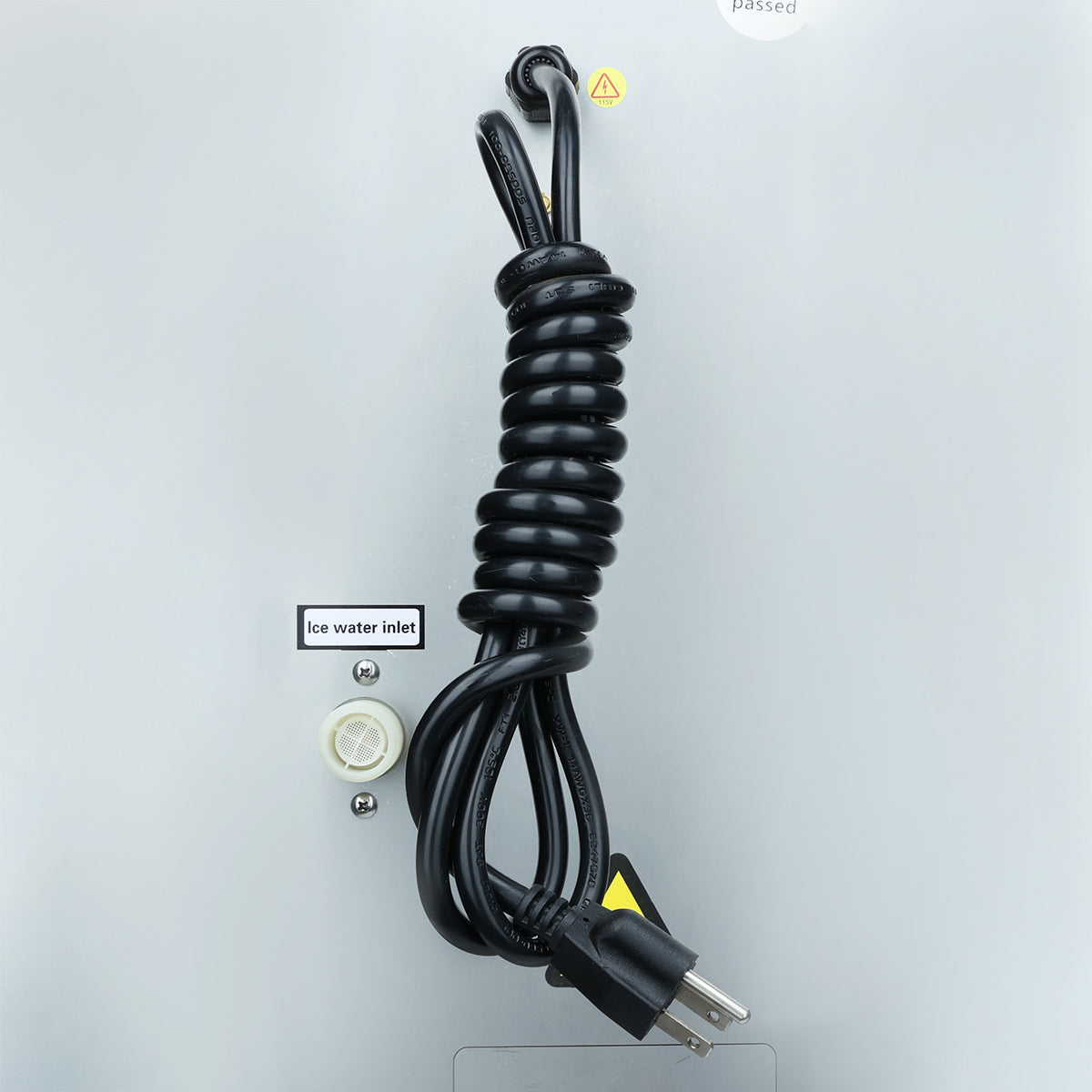 Rear view of the Empura E-MCH350 ice maker showing coiled power cord and labeled water inlet for commercial installation
