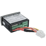 A black electronic device with labeled terminals, green connection ports, and red, yellow, and black wires attached to a white plastic connector. The top shows a detailed Empura Refrigeration label with specs and diagrams. The device sits on a white background.