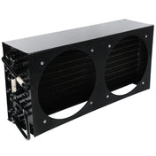 A black rectangular metal heat exchanger with two large circular cutouts on the front, revealing dense fins inside. Several black tubes and a white-wrapped pipe extend from one side—typical of Empura Refrigeration condenser coil parts.