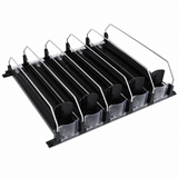 A black and transparent plastic and metal organizer rack with five angled slots, each separated by a divider. Featuring clear front stoppers and metal arms, this versatile add-on accessory is designed to hold and display items such as trays or plates.