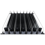 A front view of a black ski and snowboard roof rack with six parallel slots for product organization, each separated by metal rails. Clear plastic clamps secure the gear, and the rack is designed for vehicle roof mounting. The background is plain white.