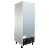 A tall, rectangular, stainless steel commercial freezer on four black caster wheels. The front features a vented black grille with a warning label, while the plain steel sides and top have a matte finish like a 23 cu. ft. freezer.