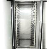 An Empura E-PR15 15-Pan Rack sits inside a tall, open refrigerator, featuring multiple horizontal rails for trays or pans. The clean, well-lit interior highlights the shiny stainless steel and spacious design.