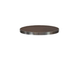 A round Sid Table Top with a dark, wood-look aluminum surface and a sleek metallic edge appears to float against a plain white background, capturing the essence of a modern outdoor table.