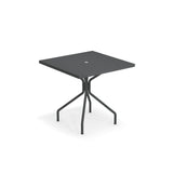 A modern square black solid steel table with a flat top and a small circular hole in the center. Featuring four angled metal legs connected by crossbars, this outdoor indoor table is made in Italy. The background is completely white.