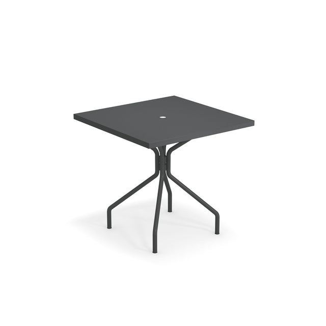A modern square black solid steel table with a flat top and a small circular hole in the center. Featuring four angled metal legs connected by crossbars, this outdoor indoor table is made in Italy. The background is completely white.