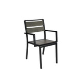 A modern indoor outdoor chair with a black metal frame, straight armrests, and two horizontal wooden slats in a light brown finish. This stacking arm chair features clean lines, a sturdy build, and a simple, geometric design.