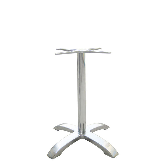 The Zak Table Base is a silver cast aluminum table base with a central cylindrical support and four wide, arched legs for stability at dining height. The top features a cross-shaped bracket to attach a tabletop, set against a plain white background.