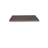 A rectangular, flat, dark brown Sid Table Top with a smooth finish and subtle horizontal grooves is shown against a plain white background. This wood-look aluminum shelf appears modern and minimalistic, designed to be wall-mounted.