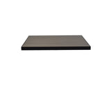 A rectangular, flat, dark-colored outdoor table top with evenly spaced parallel grooves and wood-look aluminum slats is centered on a plain white background. The platform appears to be made of sturdy composite material.