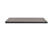 A rectangular, flat wooden shelf with a dark edge and a light brown wood grain surface, resembling a wood-look aluminum outdoor table top, is displayed against a plain white background from a slightly elevated front angle.