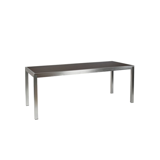 A modern rectangular Sid Community Dining Table with a dark, slatted top and four straight, metallic legs. The minimalist, functional design makes this aluminum dining table perfect for outdoor settings. Photographed against a plain white background.