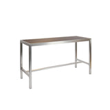 A rectangular wood-look aluminum table with a metal frame and four straight legs. Its simple, modern design is minimalist and versatile, making it suitable as an outdoor indoor table for use as a desk, dining, or community space.