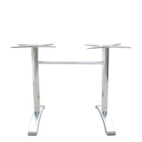 The Zak Table Base is a silver cast aluminum table base with two vertical supports ending in four-pronged mounts for tabletops. Joined by a horizontal bar near the top, it features two wide, curved legs for stability. Ideal for dining height settings.