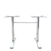 The Zak Table Base is a silver cast aluminum table base with two vertical supports ending in four-pronged mounts for tabletops. Joined by a horizontal bar near the top, it features two wide, curved legs for stability. Ideal for dining height settings.
