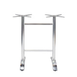 The Zak Table Base is a cast aluminum metal base with a silver finish, featuring two vertical legs connected by a horizontal bar. Each leg has a star-shaped mount on top and flat, angled feet for floor stability—ideal for bar height tables.