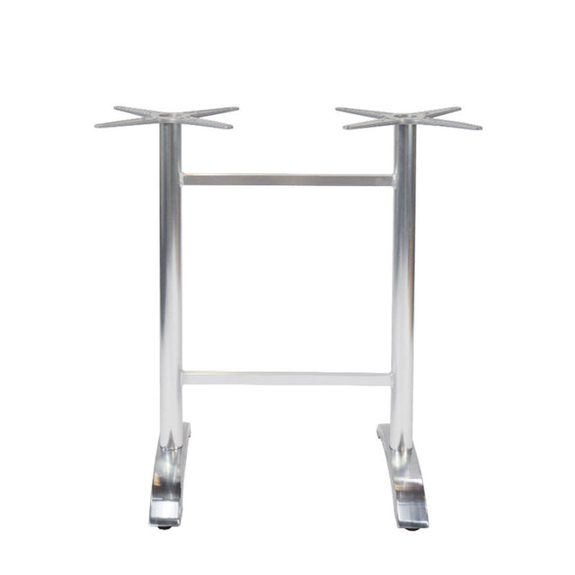 The Zak Table Base is a cast aluminum metal base with a silver finish, featuring two vertical legs connected by a horizontal bar. Each leg has a star-shaped mount on top and flat, angled feet for floor stability—ideal for bar height tables.