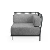 A modern Cannolè Lounge Right Corner Module with a black steel wire back, vertical slat backrest, and thick, light gray upholstered seat and back cushions. Its minimalist design suits both outdoor indoor spaces, shown against a plain white background.