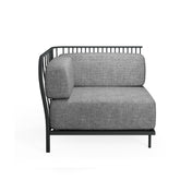 A modern Cannolè Lounge Left Corner Module with a minimalist black steel wire back and vertical slats. Light gray cushions complement its clean lines, making it perfect for stylish outdoor/indoor spaces against a plain white background.